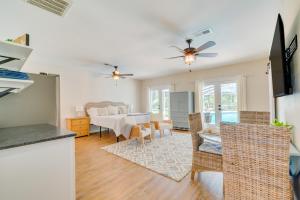 a kitchen and living room with a table and chairs at Cozy Ocala Retreat with Pool, Screened Lanai! in Ocala