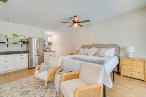 a bedroom with a bed and a kitchen at Cozy Ocala Retreat with Pool, Screened Lanai! in Ocala