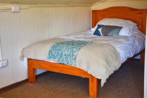 Postel nebo postele na pokoji v ubytování Hostal Triwe