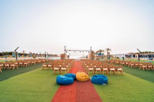 a row of chairs with bags on the ground at Gravity Hotel & Aqua Park Hurghada Families and Couples Only in Hurghada +98 photos