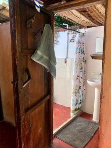 an open door to a bathroom with a toilet at Caza Terraza in Palomino