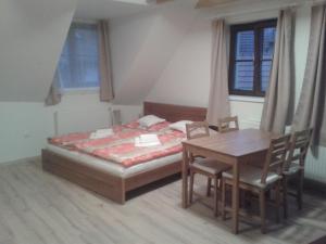 Postel nebo postele na pokoji v ubytování Dueta Apartment