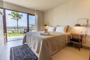 Cama ou camas em um quarto em Club do Balanço Pousada e Restaurante