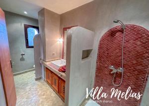 a bathroom with a shower and a sink at Villa Melias in Marrakesh