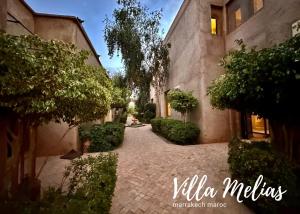 a stone walkway in front of a building at Villa Melias in Marrakesh