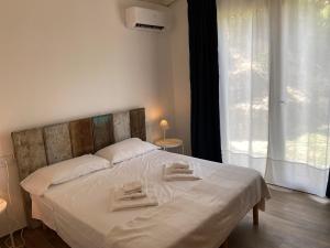 Кровать или кровати в номере Belvedere Residenza Mediterranea