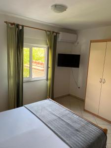 Postel nebo postele na pokoji v ubytování Apartments Edina