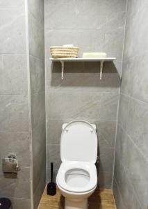 a bathroom with a white toilet in a stall at Hamza Boho Oasis in Essaouira +25 photos