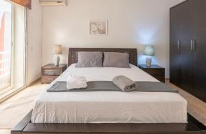 Postel nebo postele na pokoji v ubytování Cosy Apartment 200 M2 Hay Ryad Rabat