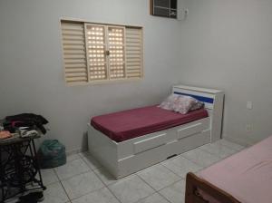 Säng eller sängar i ett rum på Casa da Cidóca