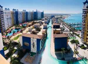 an aerial view of a resort with the ocean at PORTO MARINA North Coast -الساحل الشمالي بورتو مارينا العلمين in El Alamein