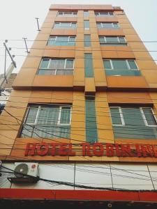 a building with a hotel roeland sign on it at Hotel Robin Inn in Amritsar