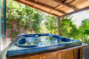 a blue tub sitting on top of a deck at חוות טפת בגלבוע-חוויה של טבע בצפון in Nurit