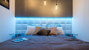 Posteľ alebo postele v izbe v ubytovaní Apartament Ap94