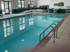 a large swimming pool with blue water at Quality Inn & Suites in Somerset