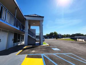 an empty parking lot next to a building at Smart Stay Lafayette in Lafayette