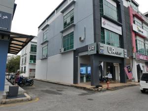a parking lot in front of a building at Pantai Regal City Hotel in Kuantan