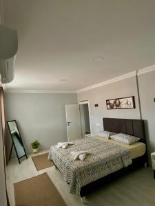 a bedroom with a bed in a room at Turgutsluxury 4 in Fethiye