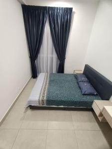 Katil atau katil-katil dalam bilik di Selesa Homestay Canopy Hills Kajang