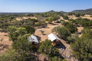 an overhead view of two tents in a field with trees at Escape Glamping Tent in Boerne
