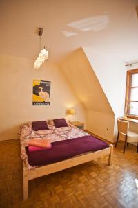 a bedroom with a bed in a attic at Center Rynek in Wrocław