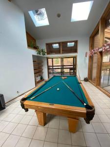 a pool table in the middle of a room at River Retreat+ Indoor Pool & Hot Tub on 3.5 Acres in Lewiston