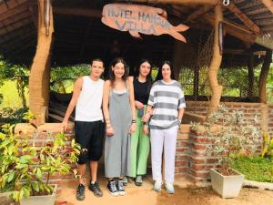 a group of women standing in front of a house at Hotel Hanguk Villa in Dambulla