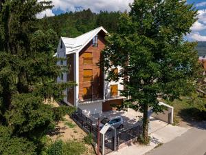 an aerial view of a house with a tree at FOREST GREEN in Kolašin