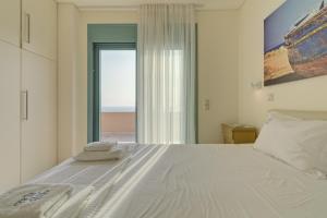 Кровать или кровати в номере Ouzo Panoramic Houses 1, with private pool
