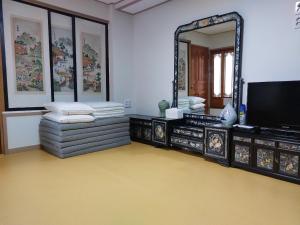 a room with a large mirror and a tv at Leedo Hanok in Seoul