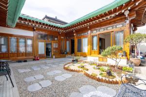 a building with a courtyard with a garden at Leedo Hanok in Seoul
