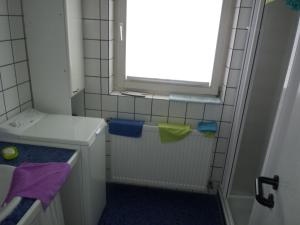 a small bathroom with a sink and a window at Oppidum Brilon in Brilon