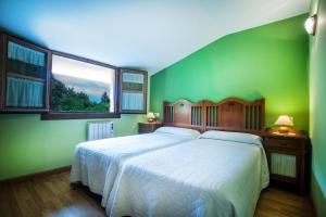 En eller flere senge i et værelse på Apartamentos El Pradón de Santa Marina