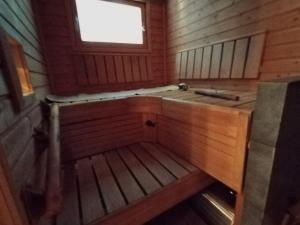 an inside view of a cabin with a window at Villa Koskikorento in Kannus +40 photos