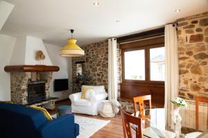 a living room with a couch and a chair at Montaña y Campo "Remanso de Paz" in Castropodame