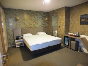 Postel nebo postele na pokoji v ubytování Colonia Park Otel + 22 fotografií
