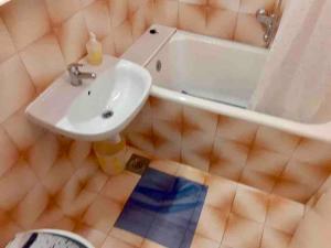 a bathroom with a sink and a tub and a white sink at Apartment Bonina in Jelsa +8 photos
