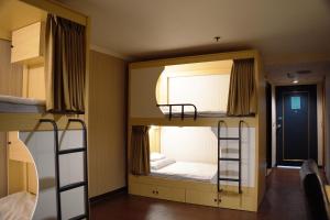 Postel nebo postele na pokoji v ubytování Hermes Hotel