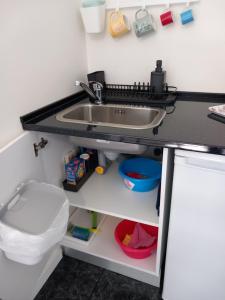 a bathroom with a sink and a toilet at Casa Porta do Sol in Estremoz