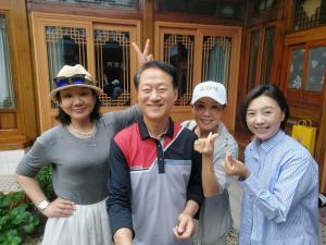 a group of three people posing for a picture at Leedo Hanok in Seoul