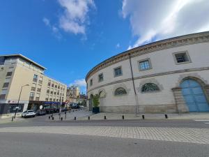 a building on the side of a street at Emplacement Top in Alençon