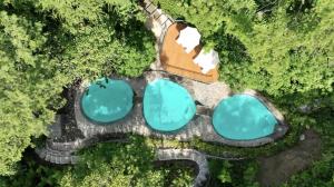 an overhead view of a resort with blue water at Suitree Experience Hotel in Guanacaste