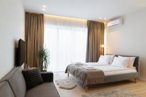 Postel nebo postele na pokoji v ubytování ММ GROUP APARTMENT