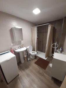 a bathroom with a sink and a toilet and a shower at Casa de tía Patricia in Montemayor del Río +19 photos