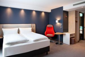 Postel nebo postele na pokoji v ubytování Holiday Inn Express Munich - Olympiapark by IHG