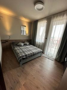 Ένα ή περισσότερα κρεβάτια σε δωμάτιο στο Art apartment Pamporovo Grand Monastery