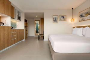 Wyndham Residences Alvor Beach客房内的一张或多张床位