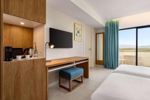 Wyndham Residences Alvor Beach客房内的一张或多张床位