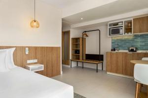 Wyndham Residences Alvor Beach客房内的一张或多张床位