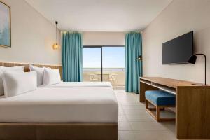 Wyndham Residences Alvor Beach客房内的一张或多张床位